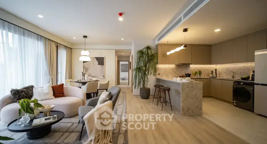 Spacious modern living room with open kitchen and stylish decor