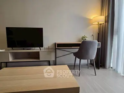 Modern living room with sleek furniture and natural light, perfect for a cozy and stylish home.