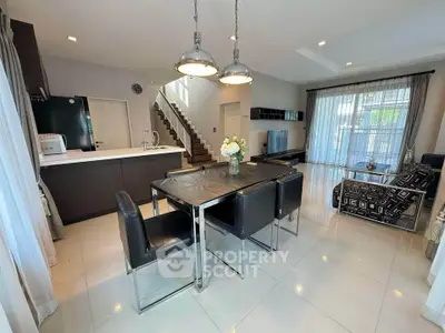 Modern open-plan living room with sleek kitchen and stylish dining area