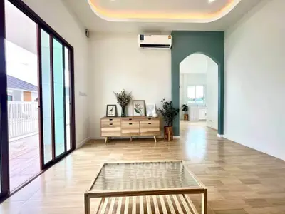 Spacious modern living room with stylish decor and natural light
