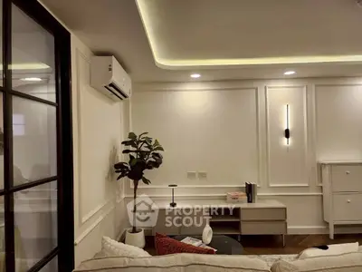 Modern living room with stylish decor and ambient lighting