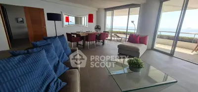 Spacious living room with ocean view and modern decor in luxury apartment