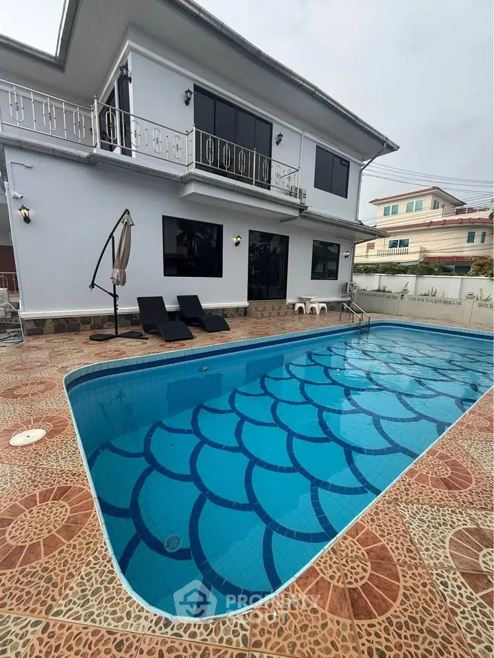 Luxurious two-story home with private pool and spacious patio, perfect for relaxation and entertainment.