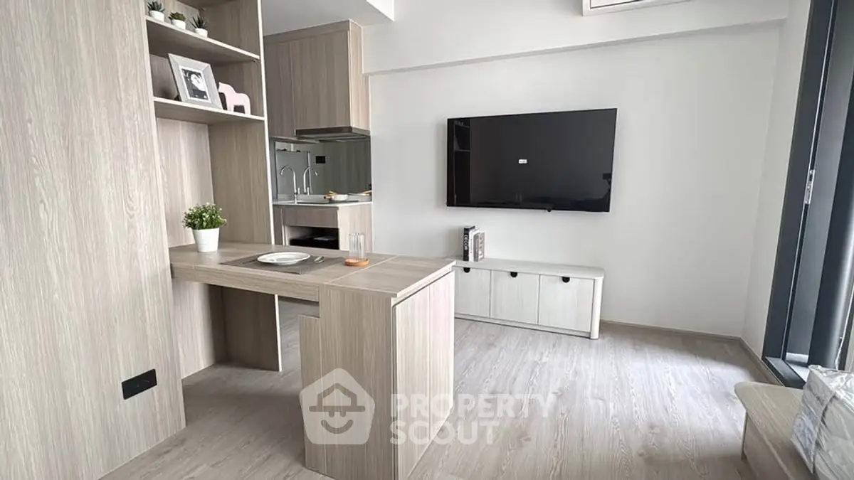 Modern living room with sleek TV setup and stylish wooden furniture