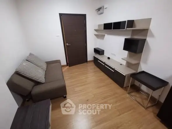 Cozy modern living room with sleek furniture and wooden flooring