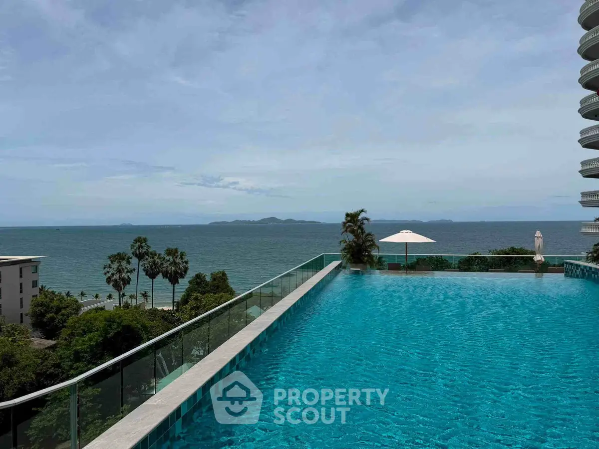 Stunning infinity pool with ocean view in luxury beachfront property.