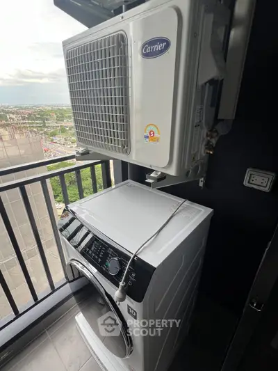 Modern balcony with washing machine and air conditioning unit, offering a practical urban living solution.