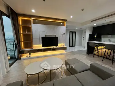 Modern living room with open kitchen and city view balcony