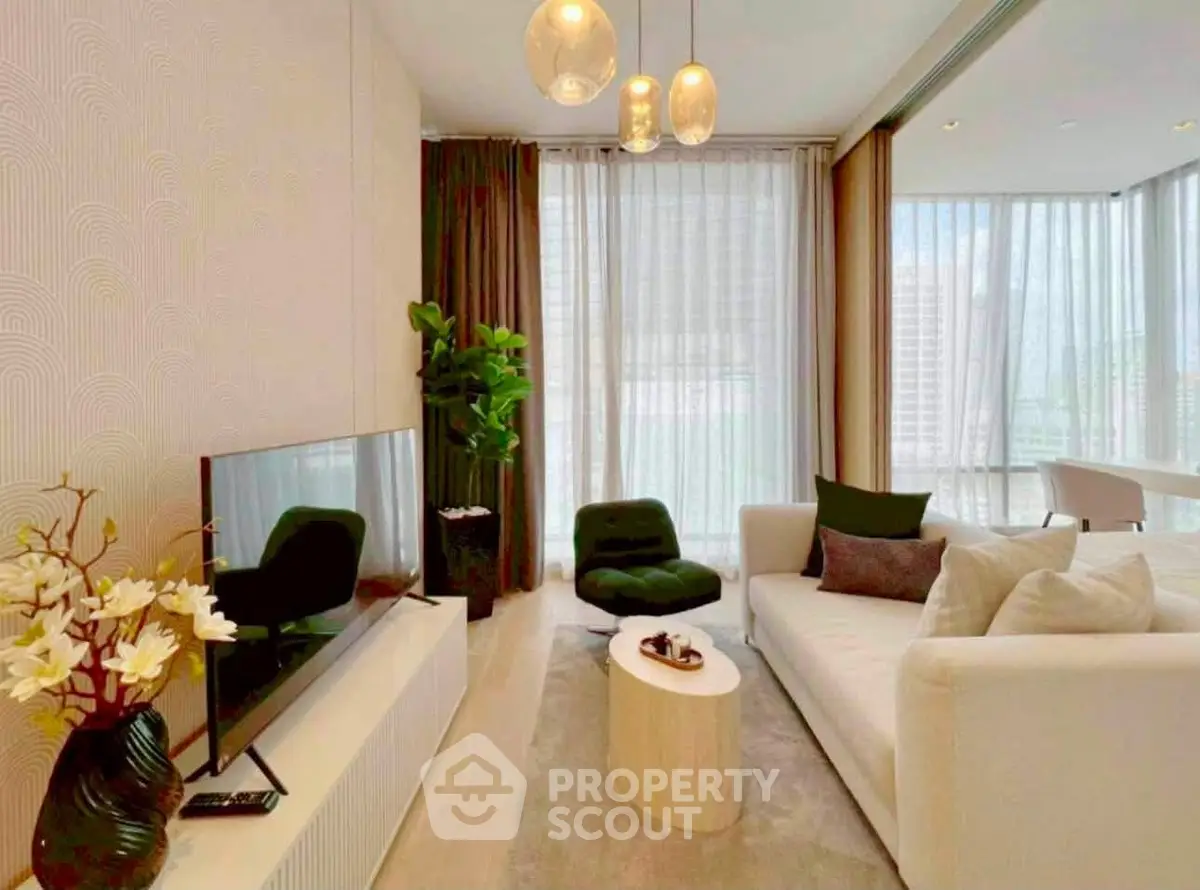 Modern living room with elegant decor, large windows, and stylish furniture in a luxury apartment.