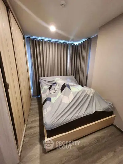 Cozy bedroom with modern design and ample natural light