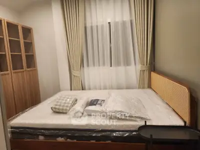 Cozy bedroom with stylish wooden bed and elegant curtains