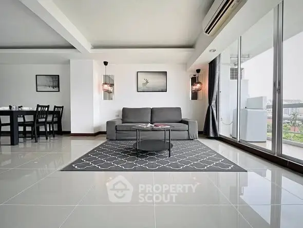 Spacious modern living room with sleek design and large windows