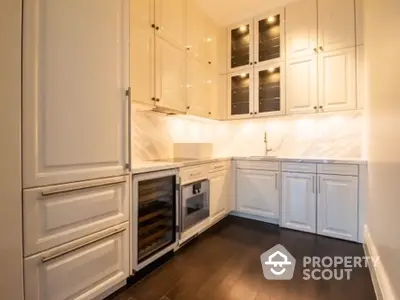 Luxurious modern kitchen with sleek cabinetry and wine cooler