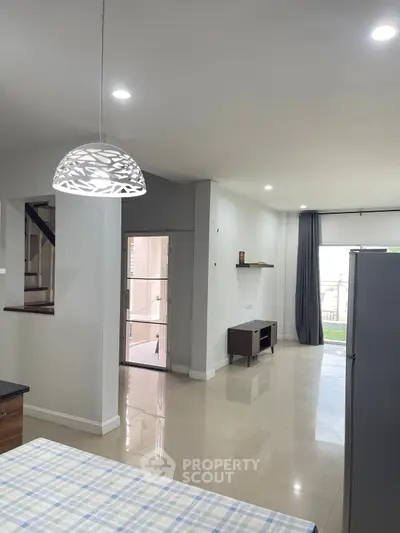 Spacious modern living room with elegant lighting and open layout