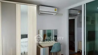 Modern bedroom with air conditioning and stylish furniture in a cozy apartment.