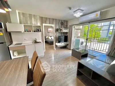 Modern open-layout living room with balcony access and stylish decor