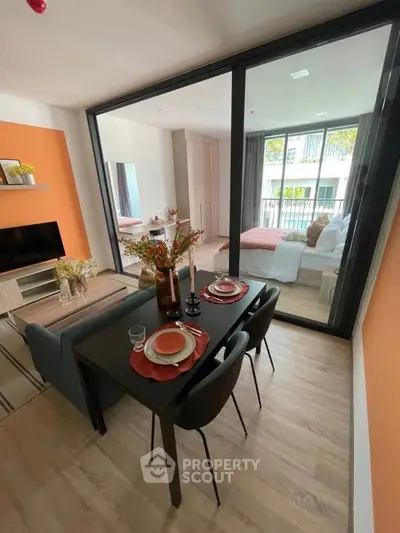 Modern open-plan living and dining area with stylish decor and natural light