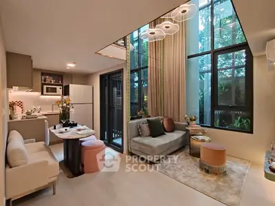 Stylish modern living room with high ceilings and large windows in a luxury apartment.