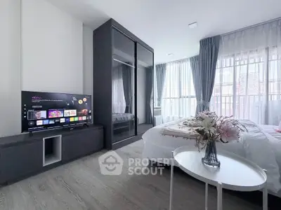 Modern bedroom with sleek design, large windows, and stylish decor