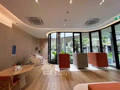 Modern living room with floor-to-ceiling windows and stylish furniture