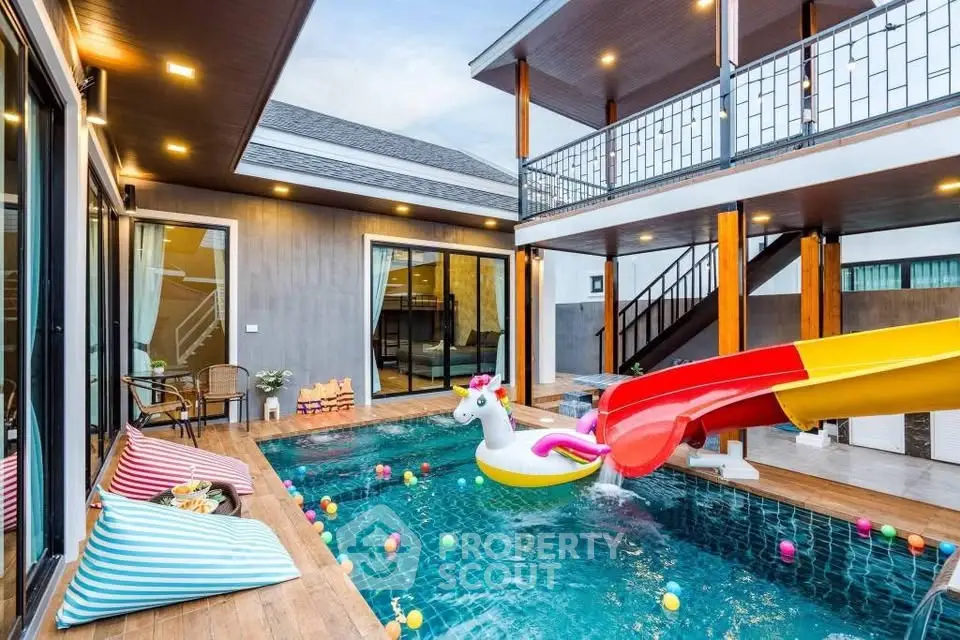 Luxurious modern villa with private pool and vibrant slide, perfect for family entertainment.