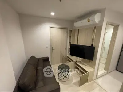 Cozy modern living room with air conditioning and sleek TV setup