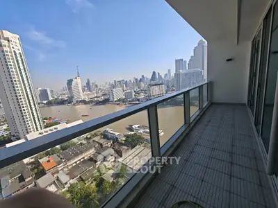 Stunning high-rise balcony with panoramic city and river views, perfect for urban living.