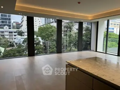 Spacious modern living room with large windows and city view