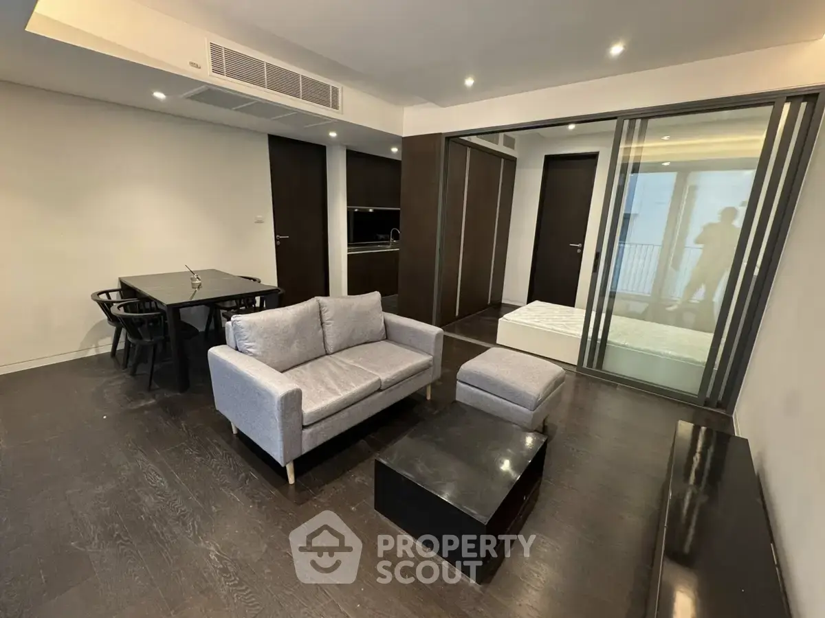 Modern living room with sleek furniture and open layout in a stylish apartment.