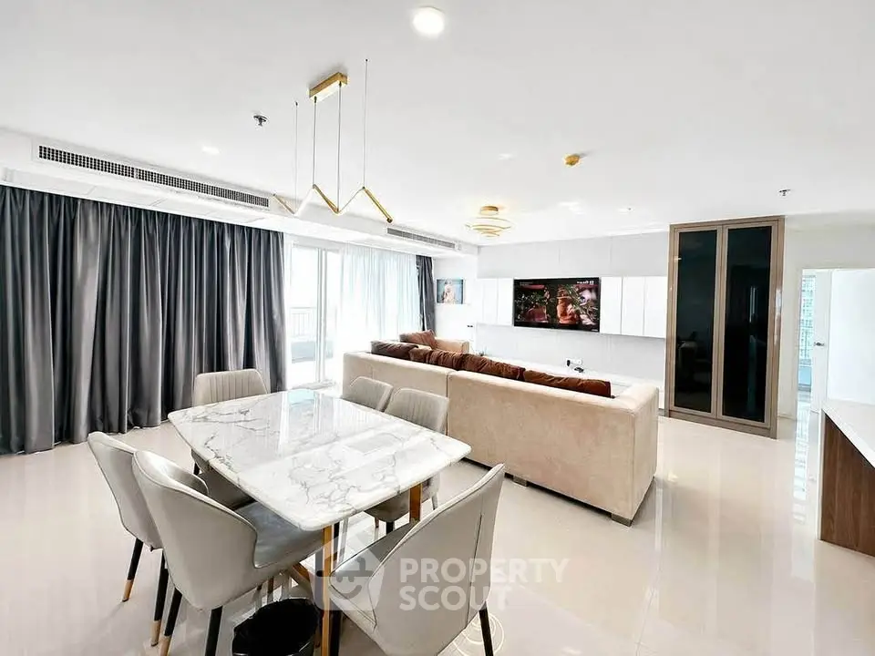 Spacious modern living room with elegant dining area and large windows