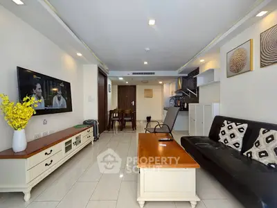Modern living room with sleek furniture and open kitchen layout