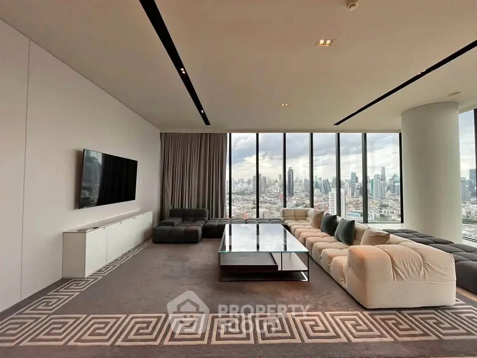 Luxurious living room with panoramic city views and modern furnishings