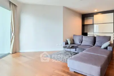 Spacious modern living room with cozy sectional sofa and elegant decor