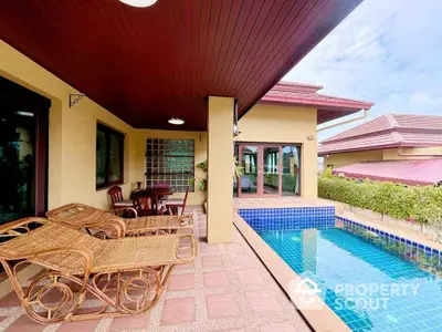 Luxurious villa with private pool and spacious patio in tropical setting