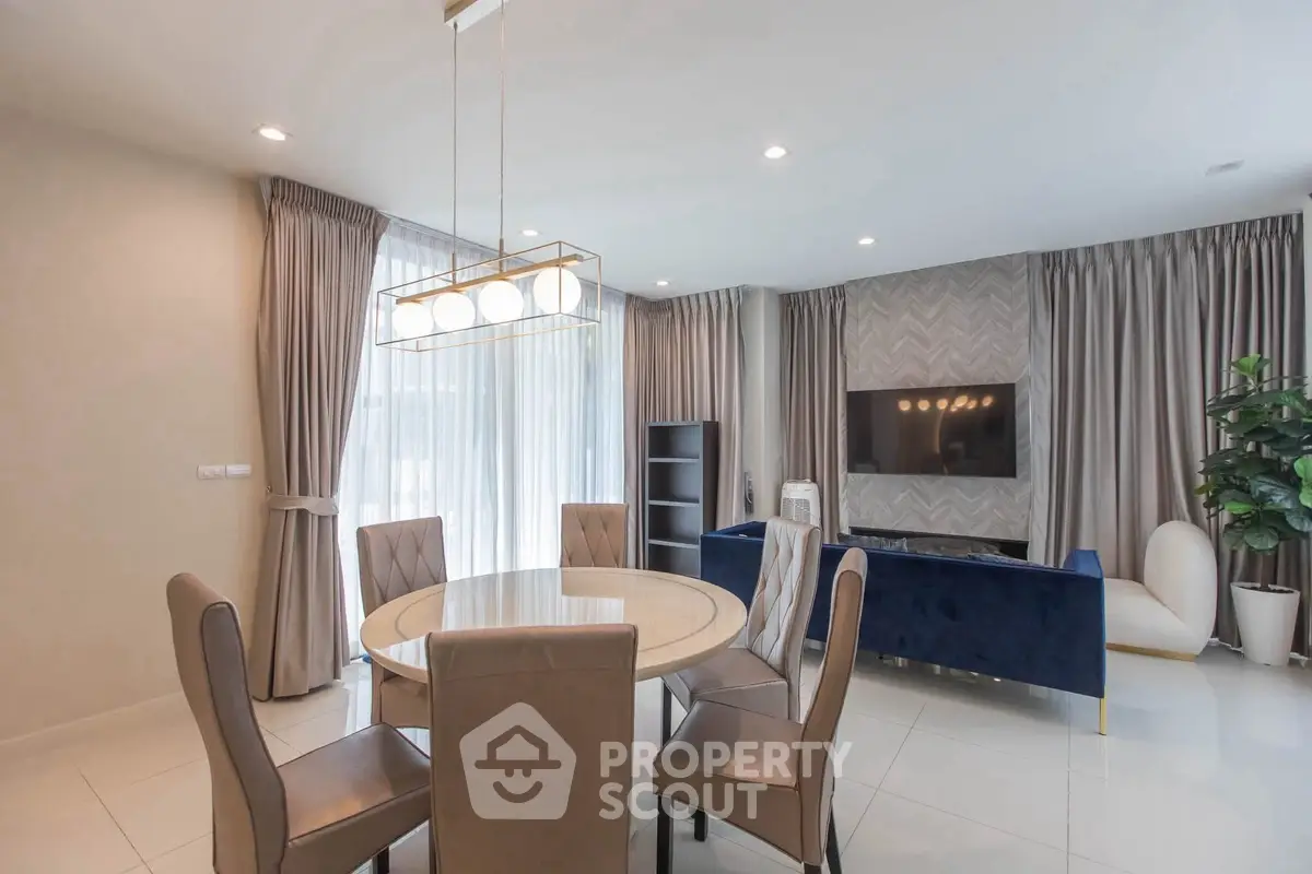 Elegant living room with modern dining area and stylish decor