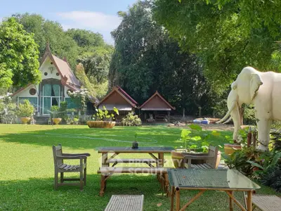 Charming garden view with unique architecture and outdoor seating area