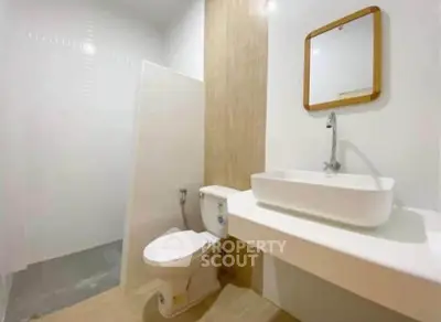 Modern minimalist bathroom with sleek fixtures and neutral tones