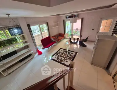 Spacious modern living room with stylish furniture and large windows for natural light.
