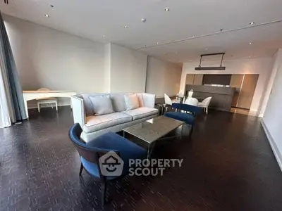 Spacious modern living room with elegant furniture and open layout, perfect for entertaining.