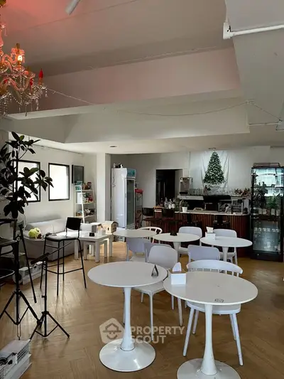 Charming cafe-style living area with modern decor and cozy seating.
