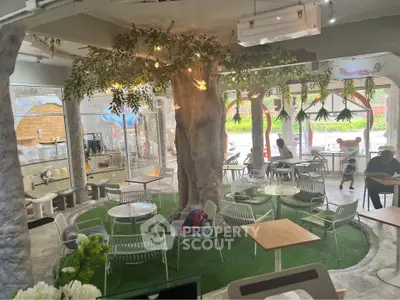 Charming cafe with indoor garden theme and cozy seating area