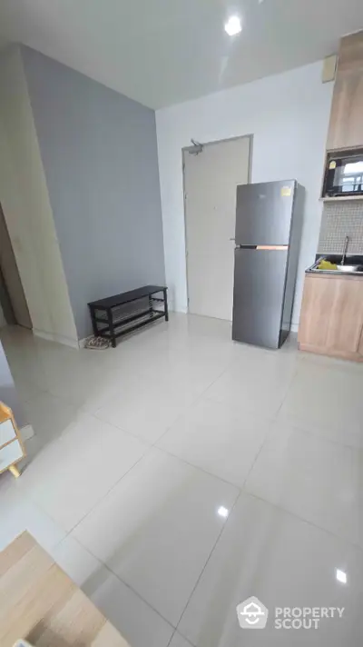 Modern kitchen with sleek fridge and minimalist design