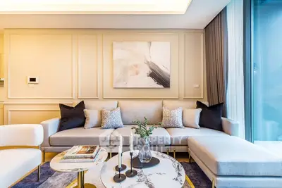 Luxurious modern living room with elegant decor and large windows