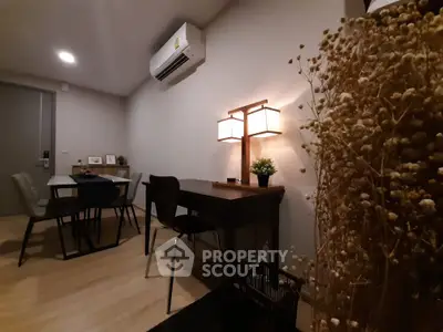Cozy modern living space with dining area and stylish lighting
