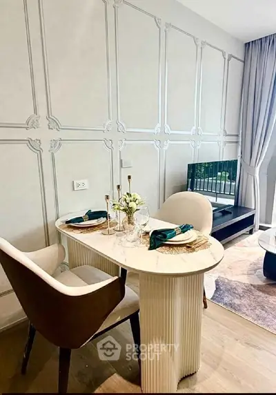 Elegant dining area with stylish chairs and marble table in modern apartment
