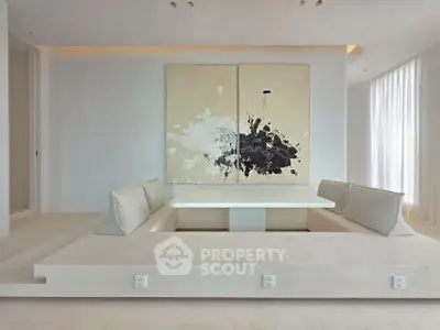 Modern minimalist living room with built-in seating and abstract art
