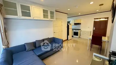 Spacious open-layout living room with modern kitchen and stylish furnishings