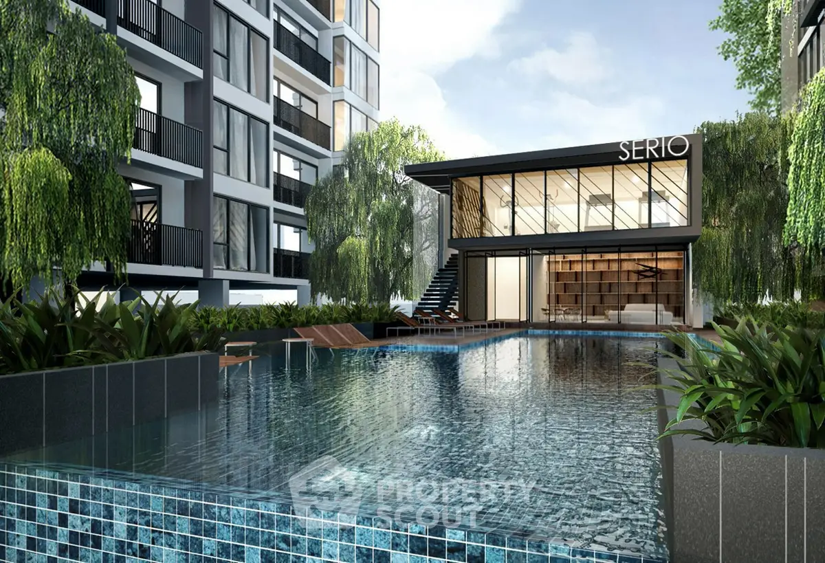 Luxurious modern apartment complex with stunning pool and lush greenery.