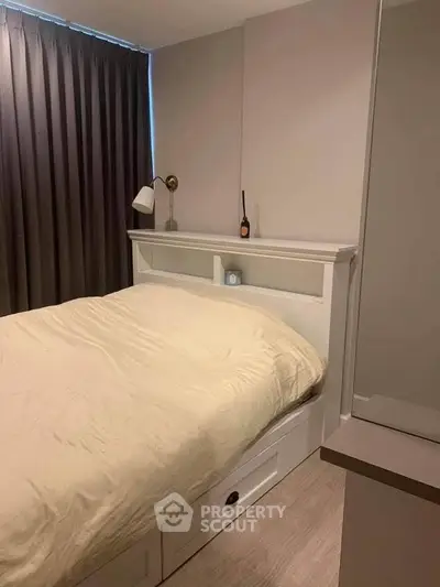 Cozy bedroom with modern decor and ample natural light