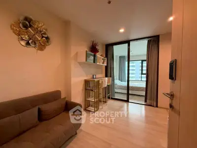 Modern apartment interior with cozy living area and bedroom view